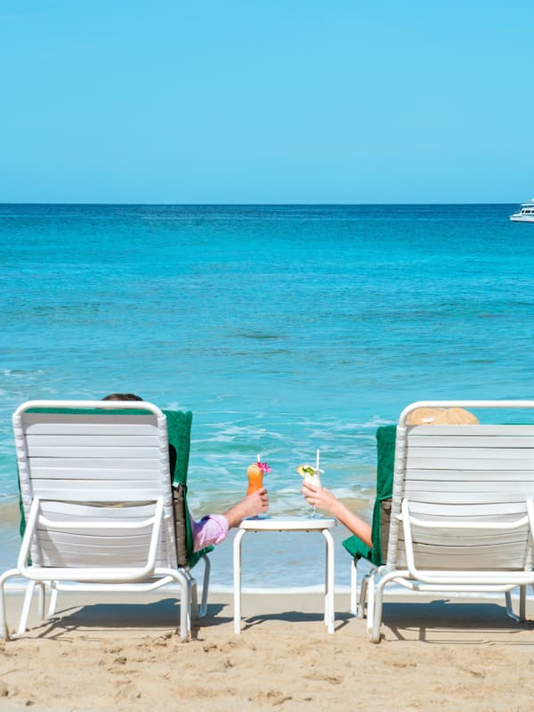 On the beach, white sand, sun loungers, scuba diving