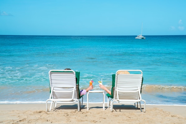 On the beach, white sand, sun loungers, scuba diving