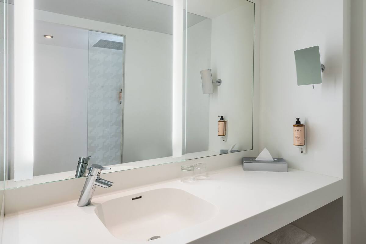 shower, eco-friendly toiletries, hair dryer, towels