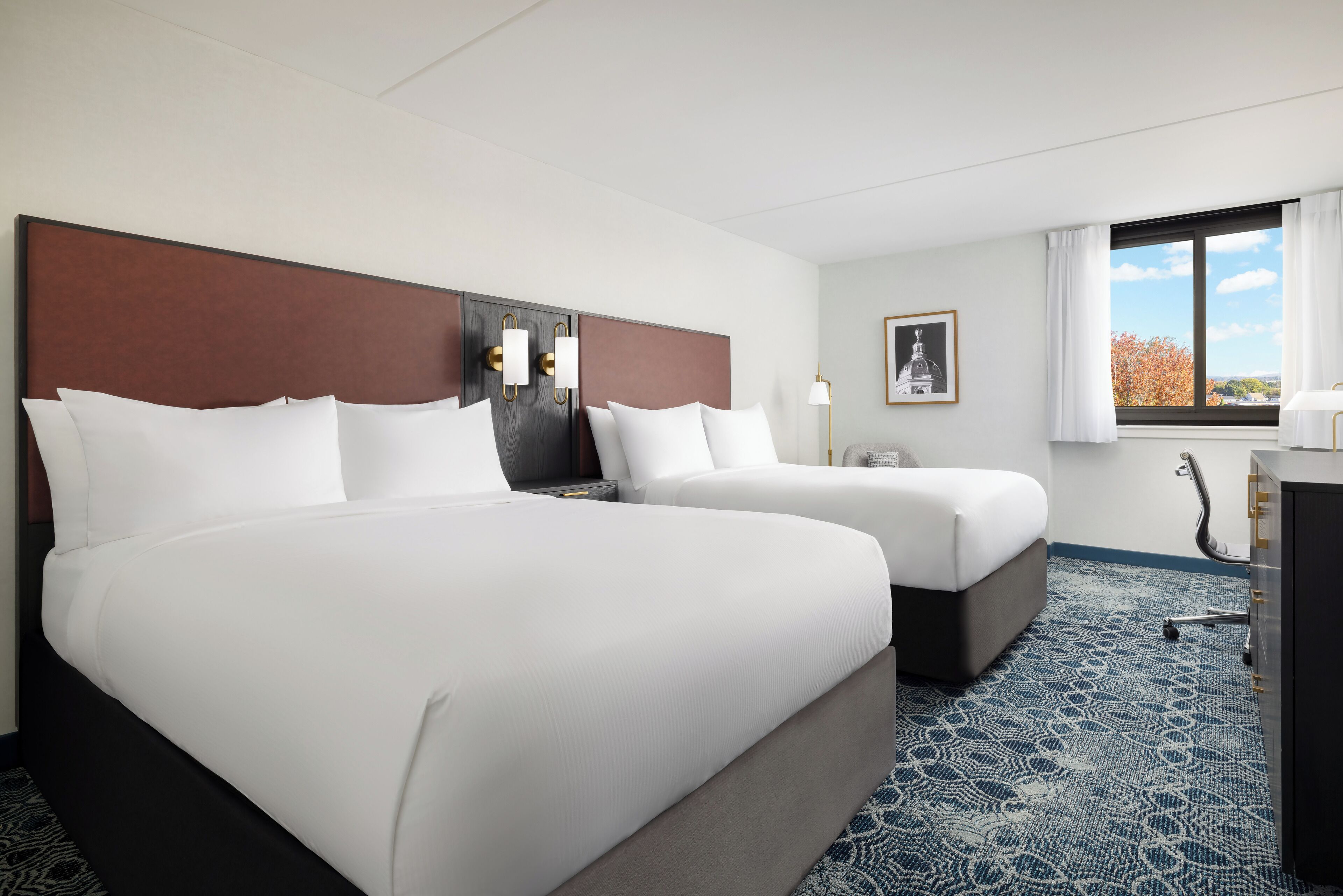 Down duvets, pillow-top beds, desk, laptop workspace