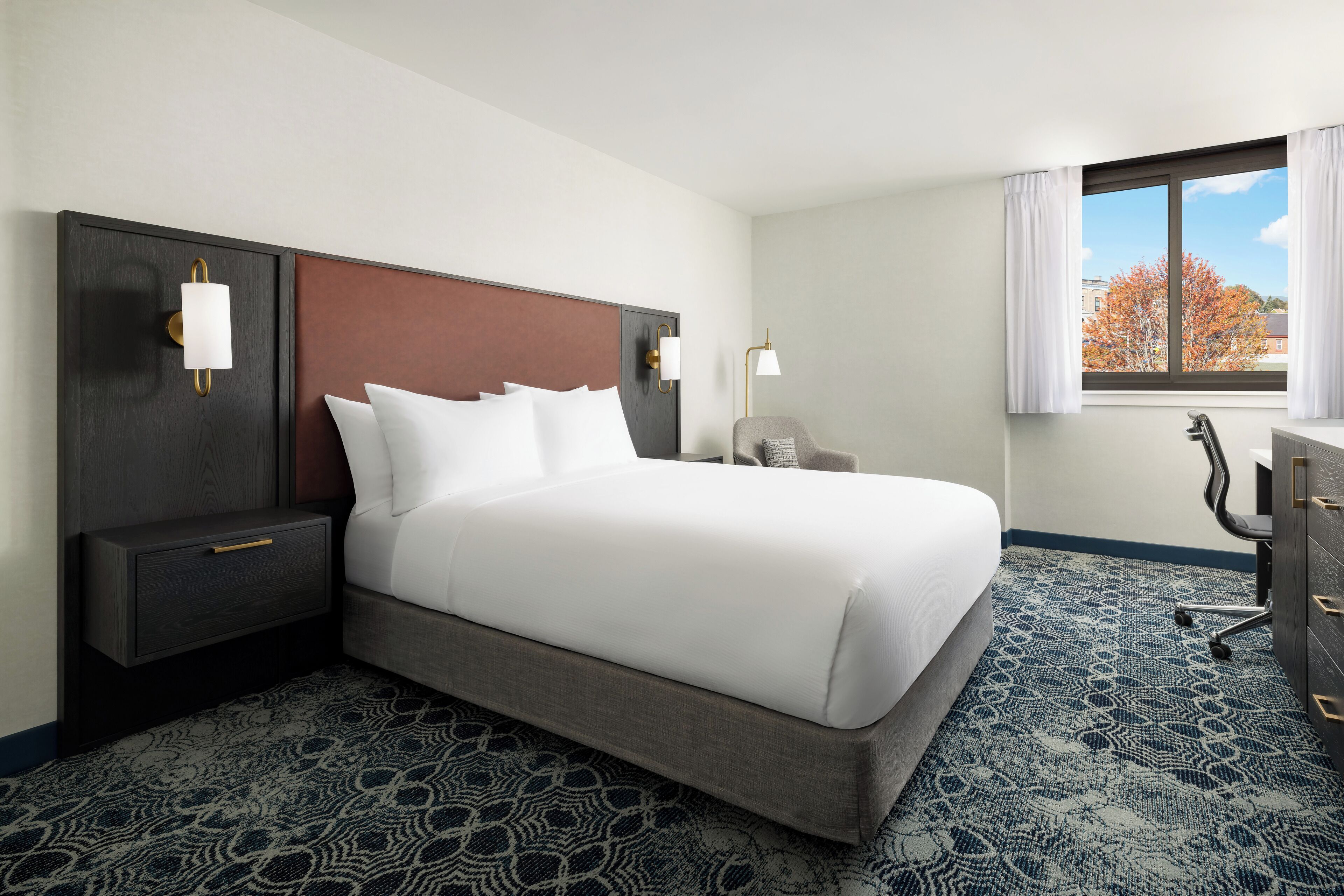 Down duvets, pillow-top beds, desk, laptop workspace