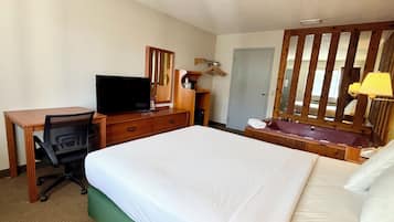 Deluxe Room, 1 Queen Bed, Jetted Tub | Iron/ironing board, cribs (free), WiFi (free), alarm clocks