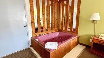 Deluxe Room, 1 Queen Bed, Jetted Tub | Iron/ironing board, free cots/infant beds, free WiFi, alarm clocks
