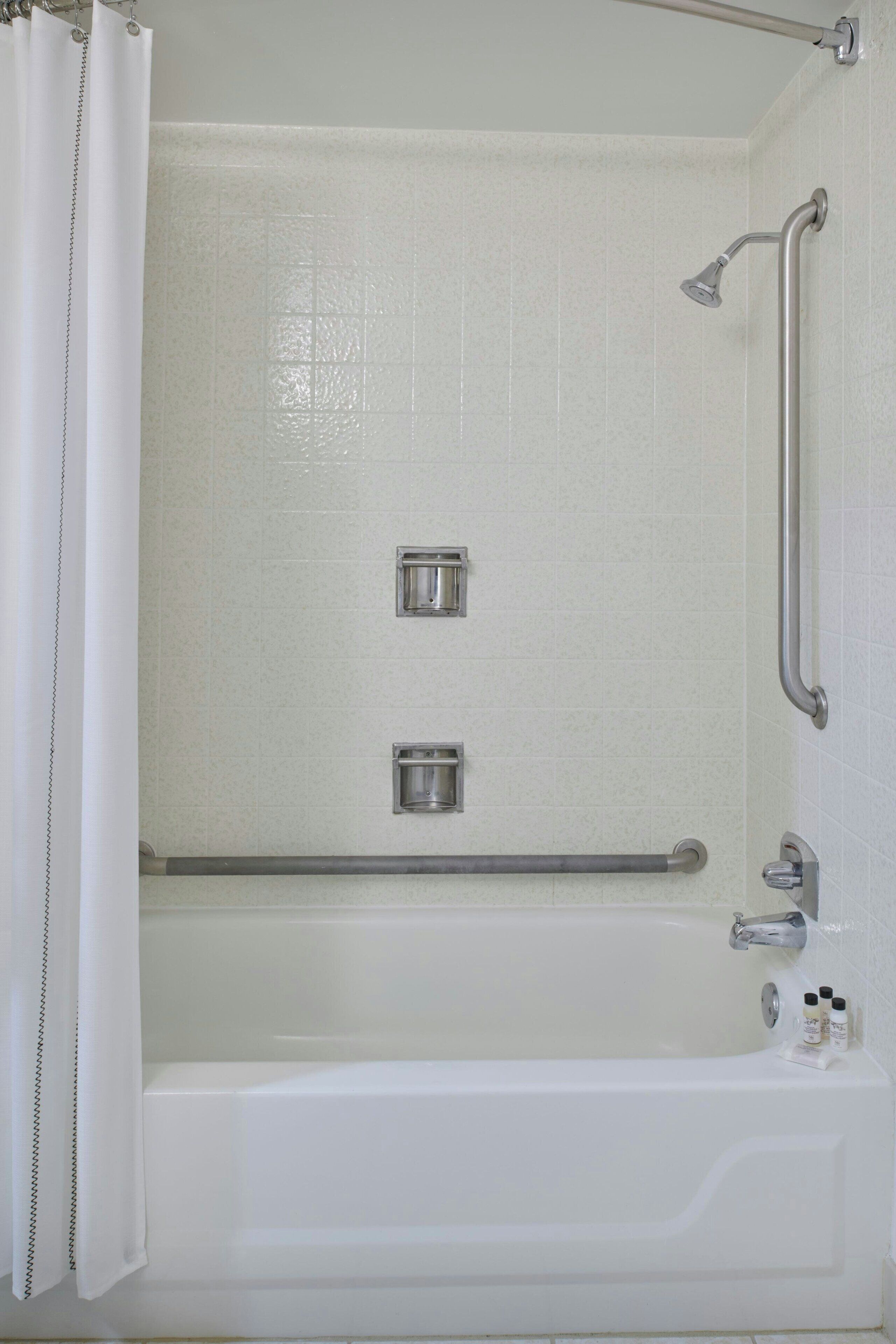 designer toiletries, hair dryer, towels, soap