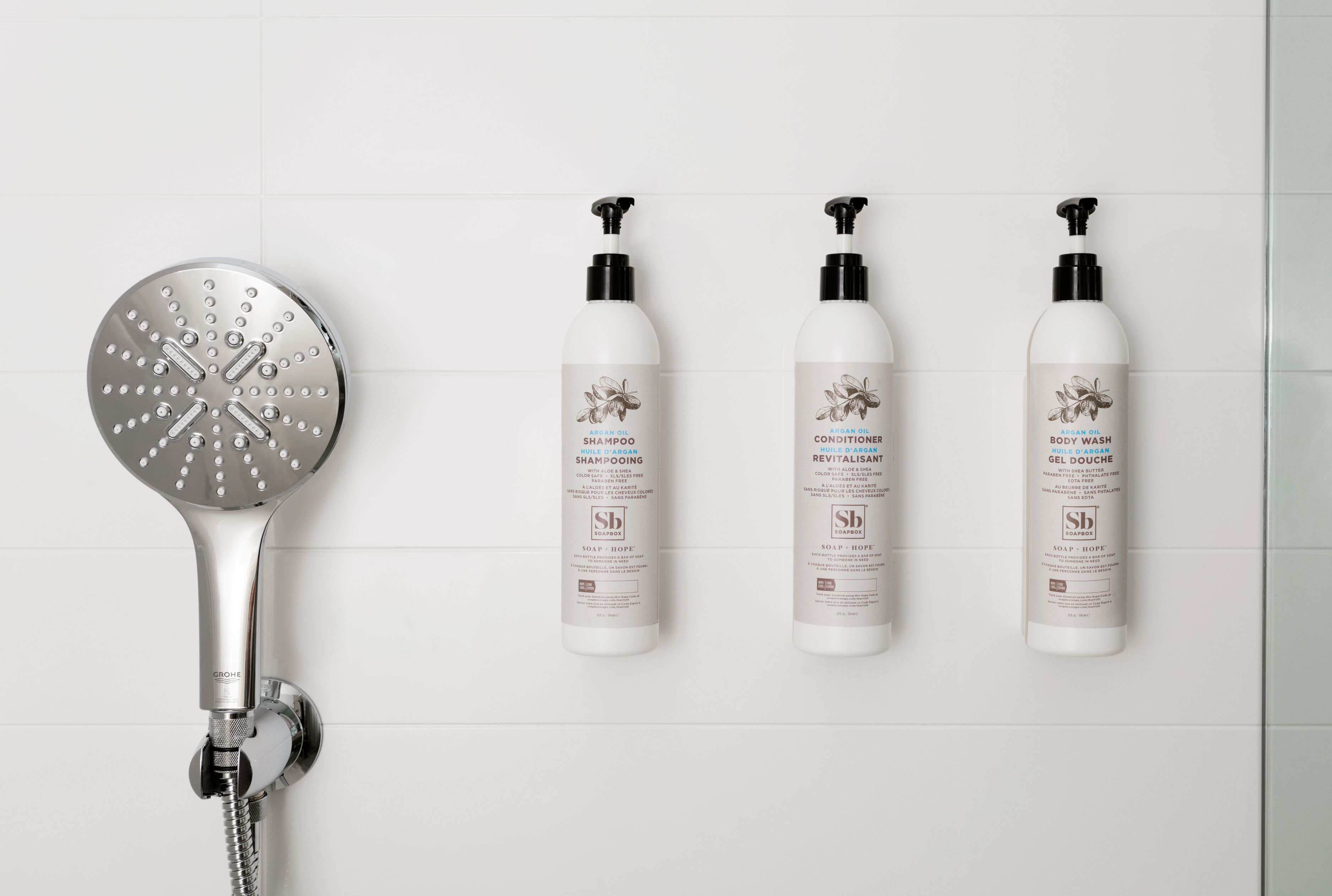 designer toiletries, hair dryer, towels, soap