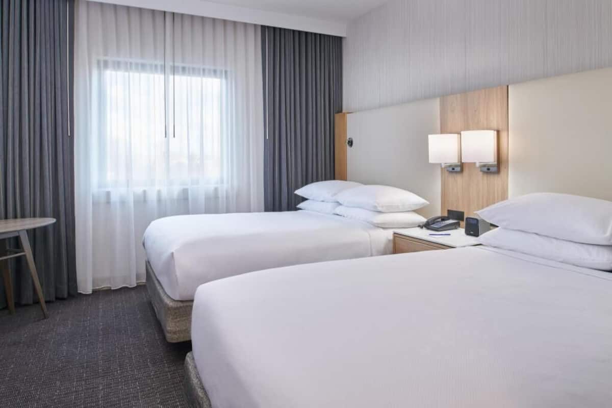 Hypo-allergenic bedding, down comforters, in-room safe, desk