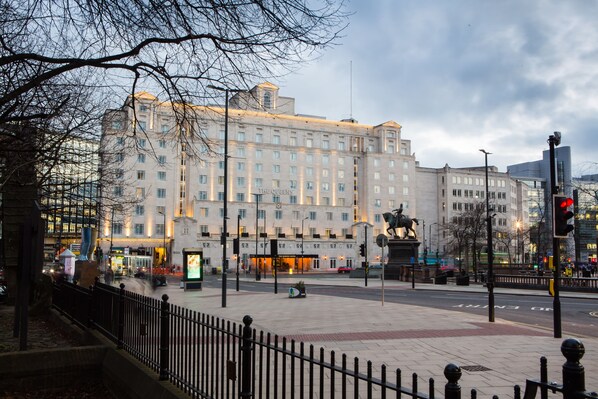 A large hotel with multiple floors and a prominent entrance.