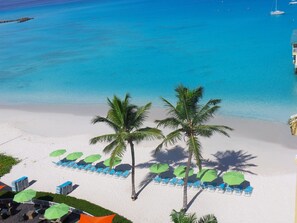On the beach, white sand, sun loungers, beach umbrellas - Radisson Aquatica Resort Barbados (Bridgetown)
