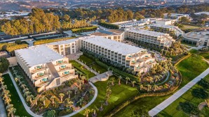 A modern hotel complex with multiple buildings, landscaped gardens, and a central courtyard. - Hilton La Jolla Torrey Pines (La Jolla)