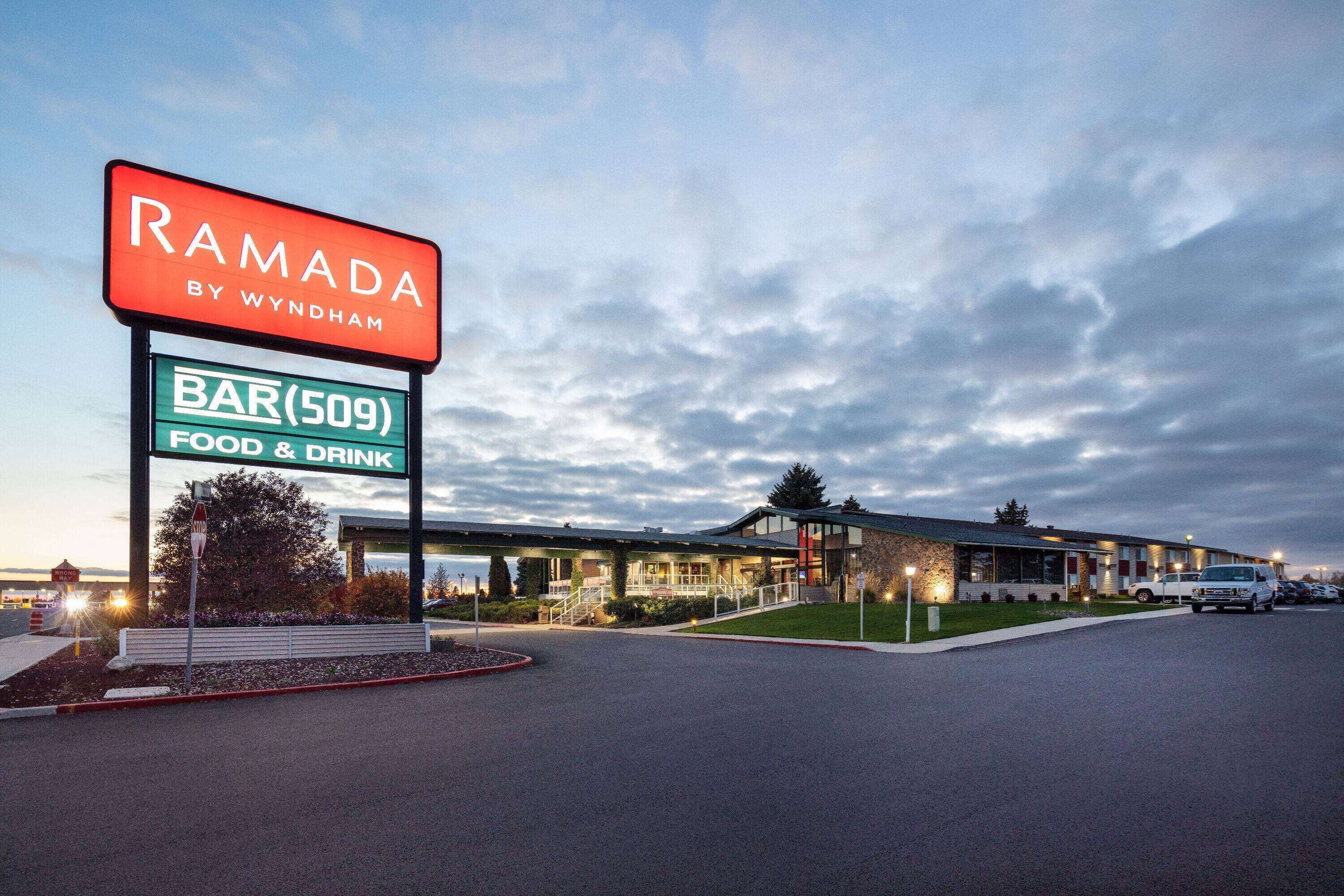 A Ramada by Wyndham hotel with a bar, food & drink, and a covered walkway.