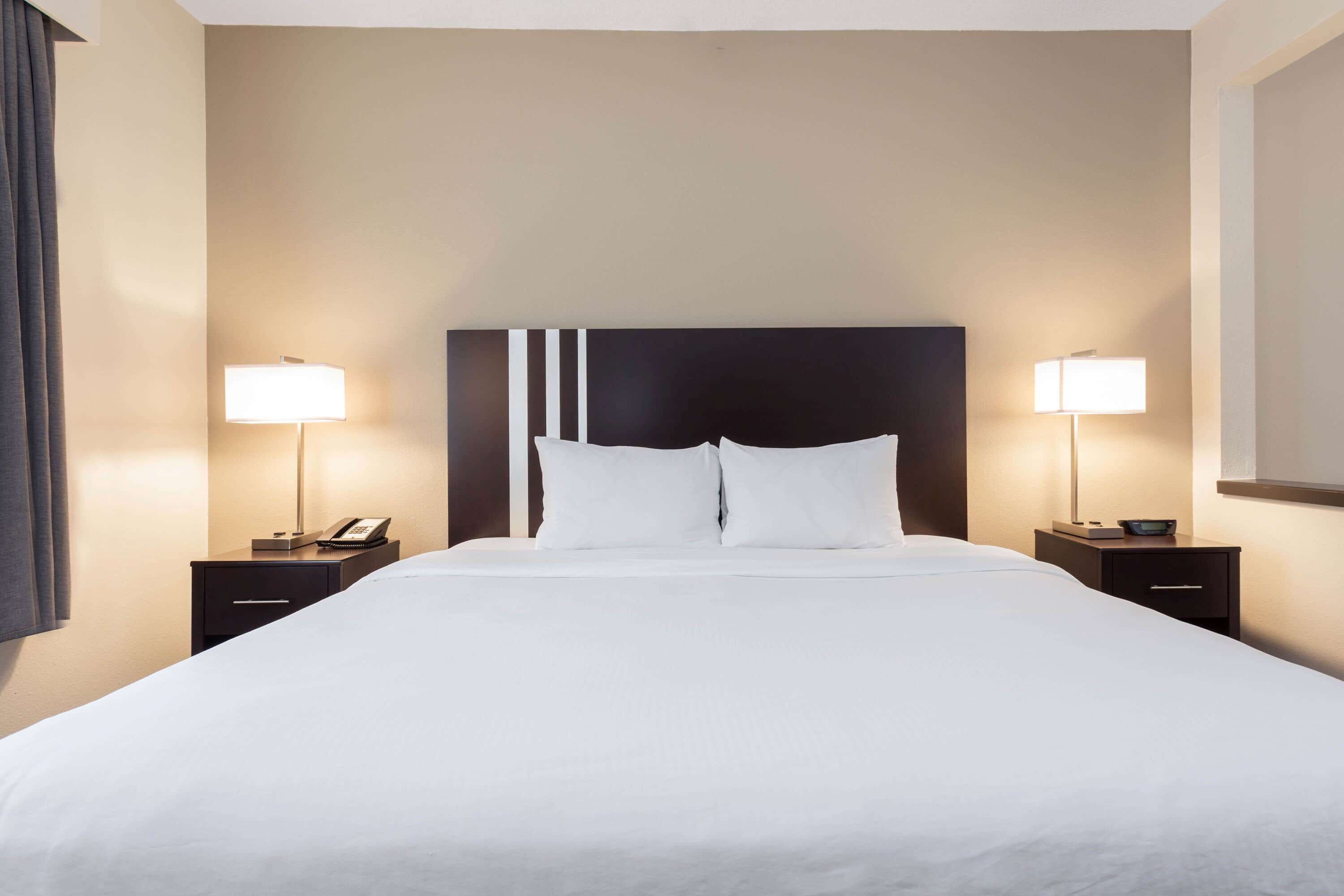 desk, laptop workspace, blackout curtains, iron/ironing board