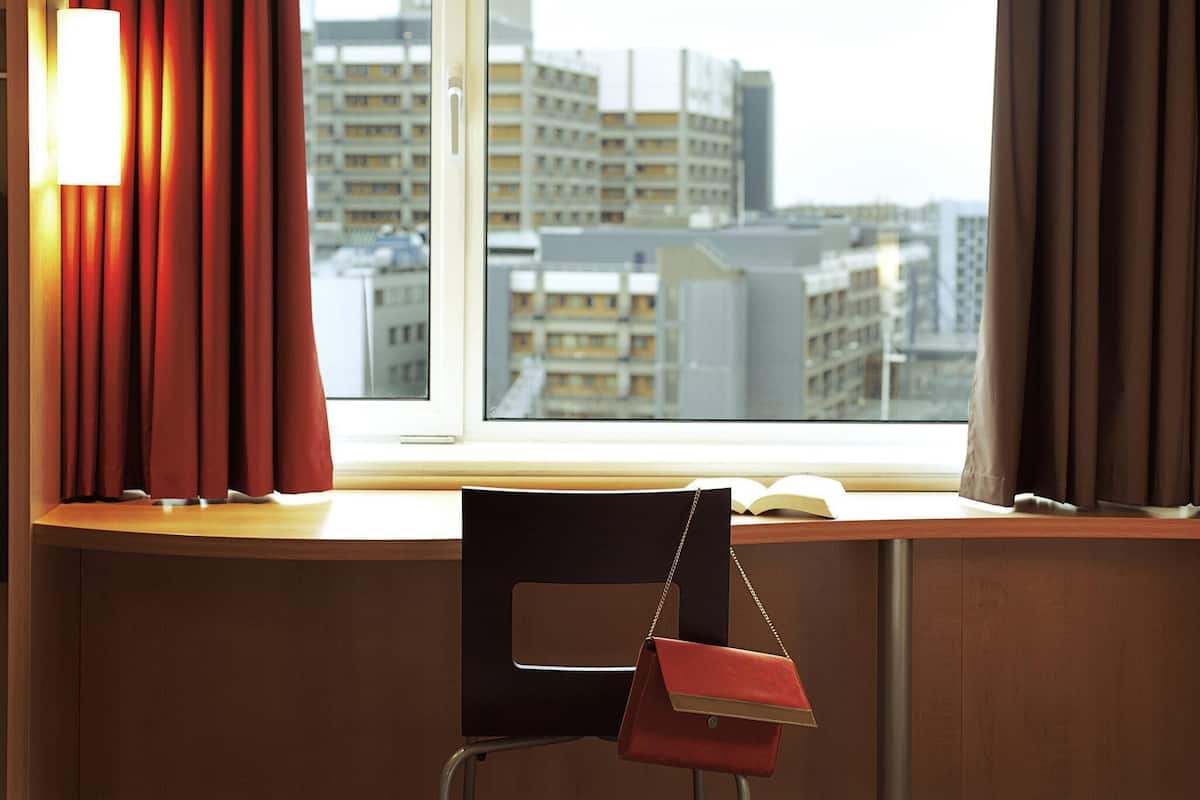 Desk, laptop workspace, blackout curtains, iron/ironing board