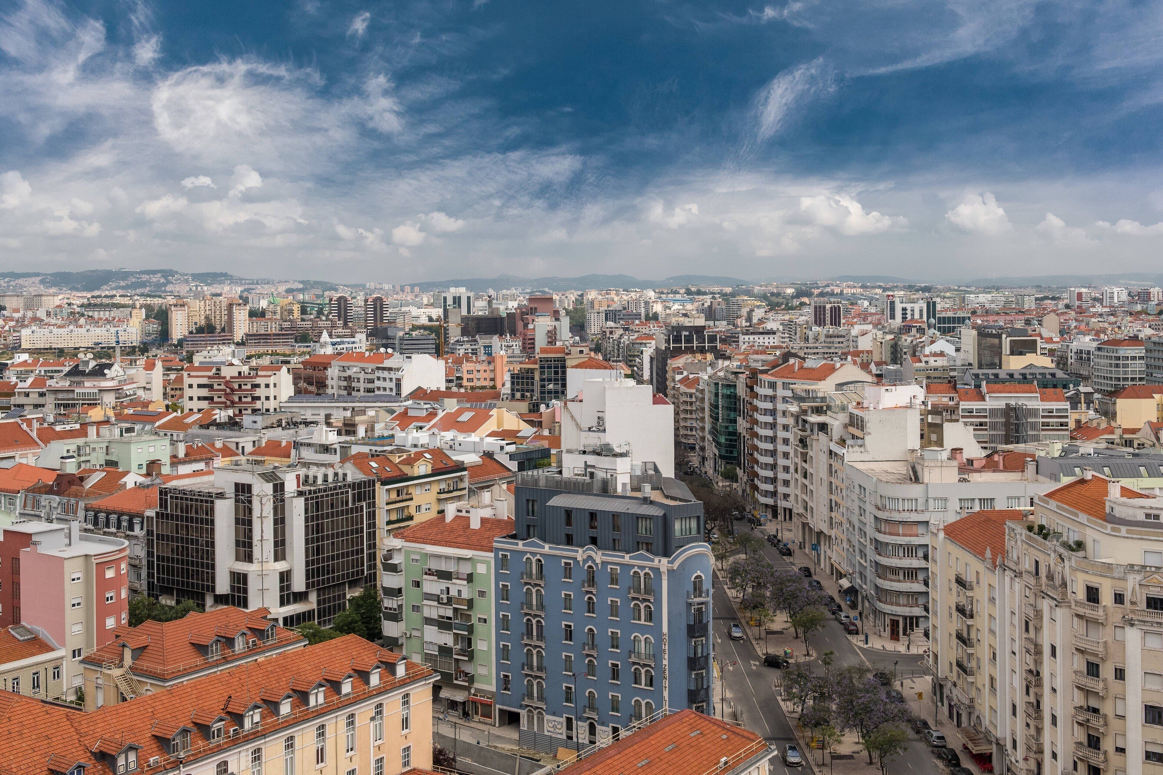 A cityscape with a variety of building styles, including modern and traditional architecture.