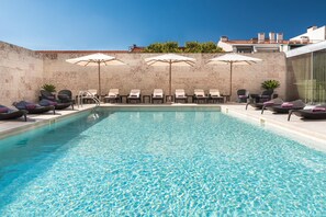 Outdoor pool, open 8:00 AM to 8:00 PM, pool umbrellas, pool loungers