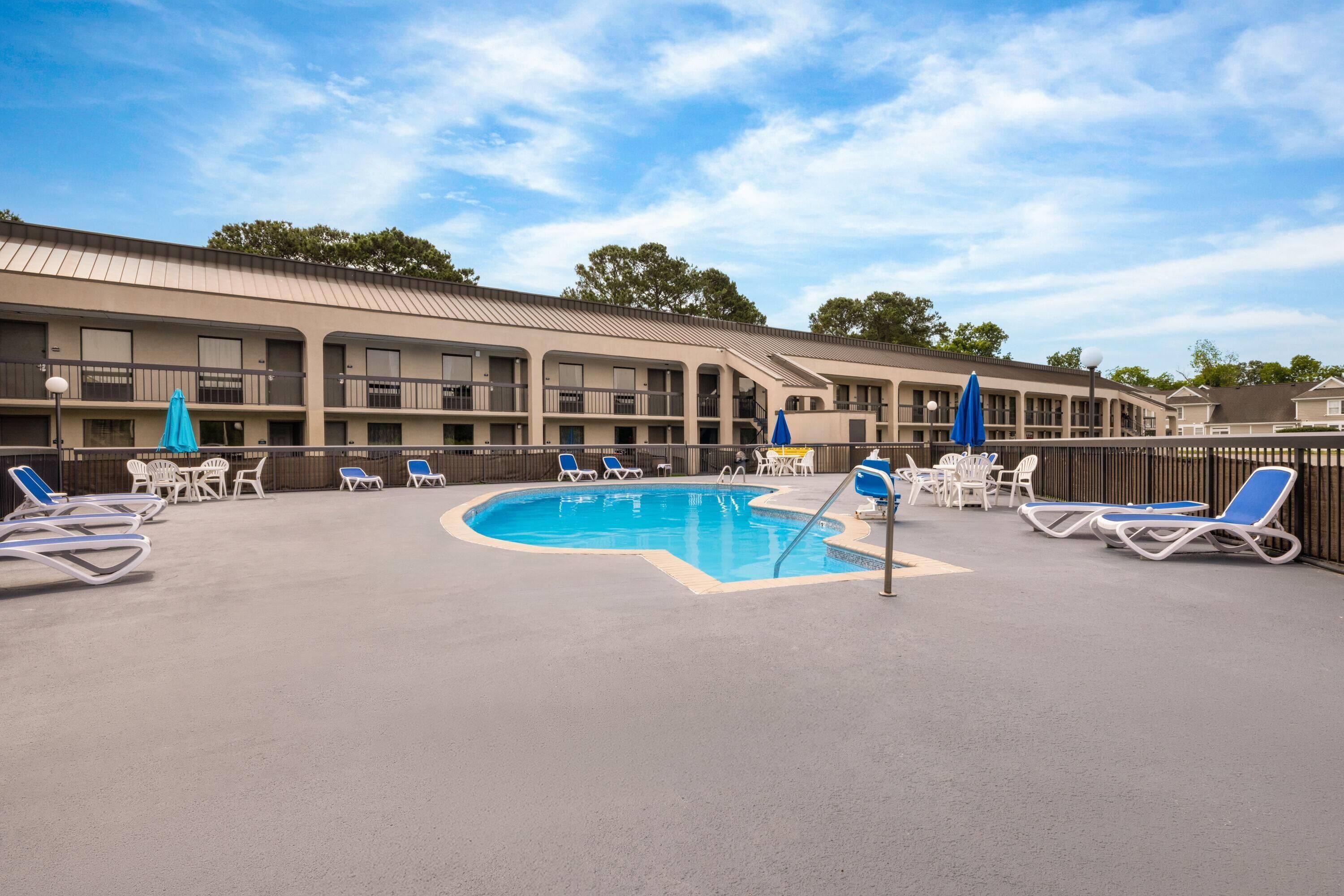 Seasonal outdoor pool, open 10 AM to 6:00 PM, pool umbrellas