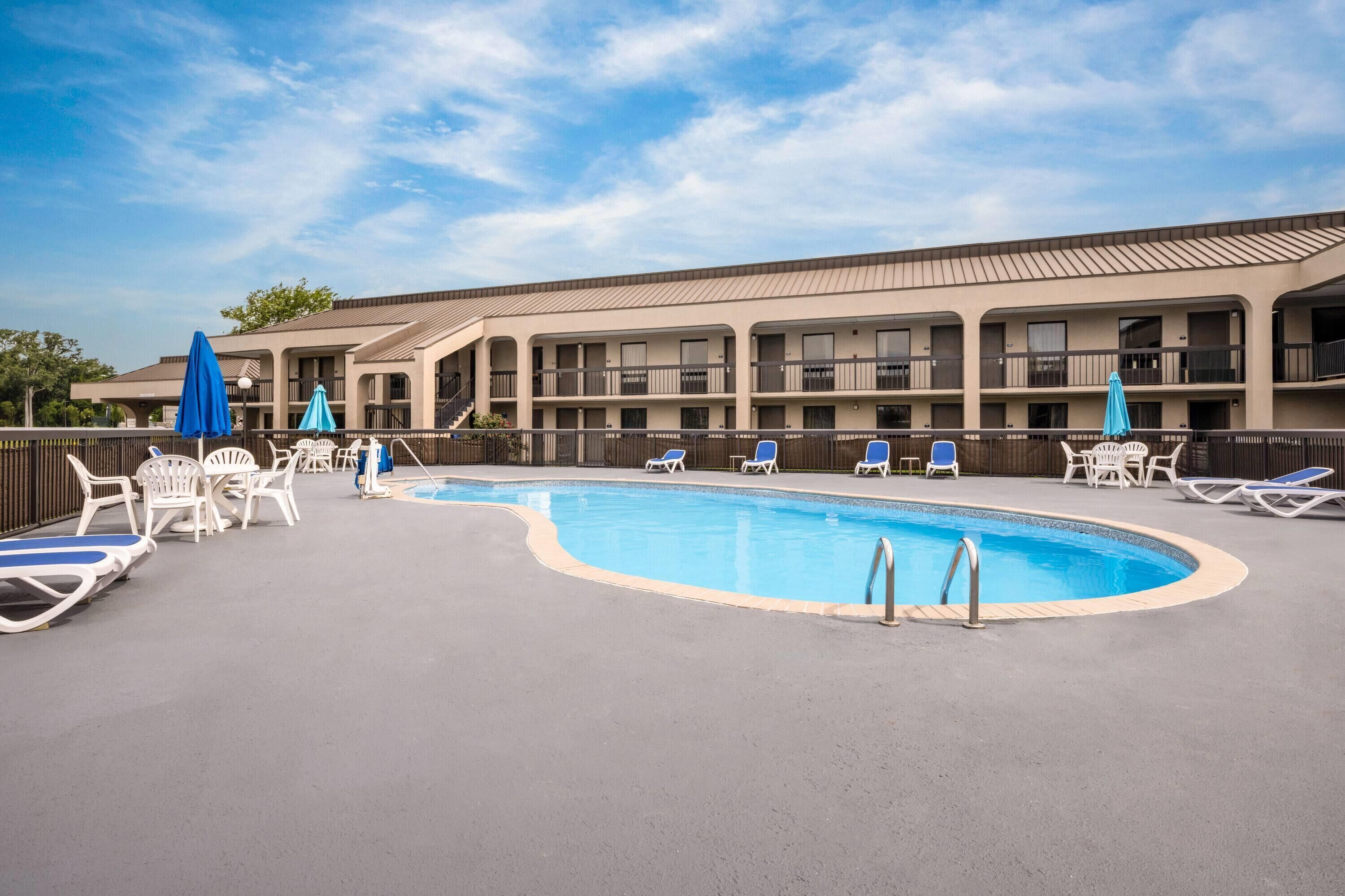 Seasonal outdoor pool, open 10 AM to 6:00 PM, pool umbrellas