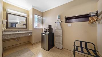 Premium bedding, desk, laptop workspace, iron/ironing board