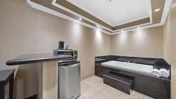 Premium bedding, desk, laptop workspace, iron/ironing board