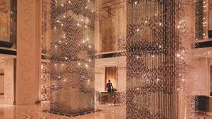 A spacious lobby with high ceilings, large columns, and a reflective floor. - Shangri-La Beijing (Beijing)