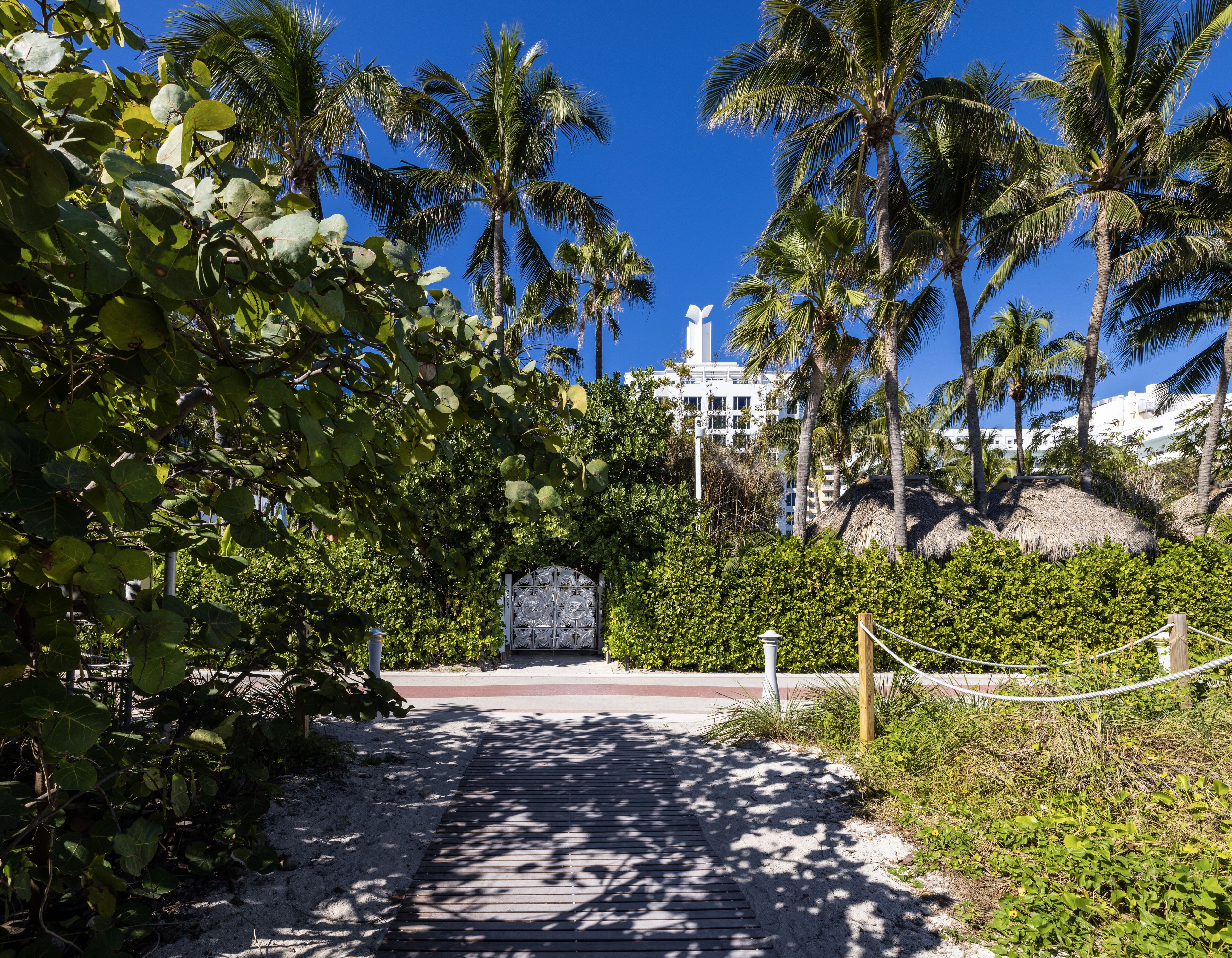 on the beach, beach cabanas, sun-loungers, beach umbrellas