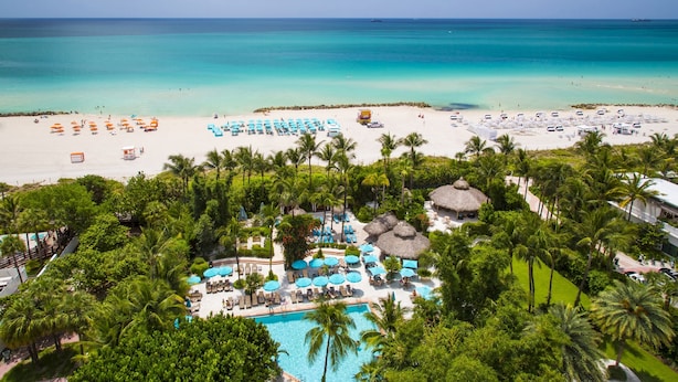 A resort with a pool, beach, and ocean view. - The Palms Hotel & Spa (Miami Beach)