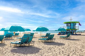 On the beach, beach cabanas, sun loungers, beach umbrellas