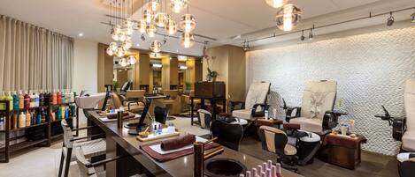 A modern spa with multiple treatment rooms, a reception area, and a variety of amenities including a reception desk, chairs, and a counter with products.