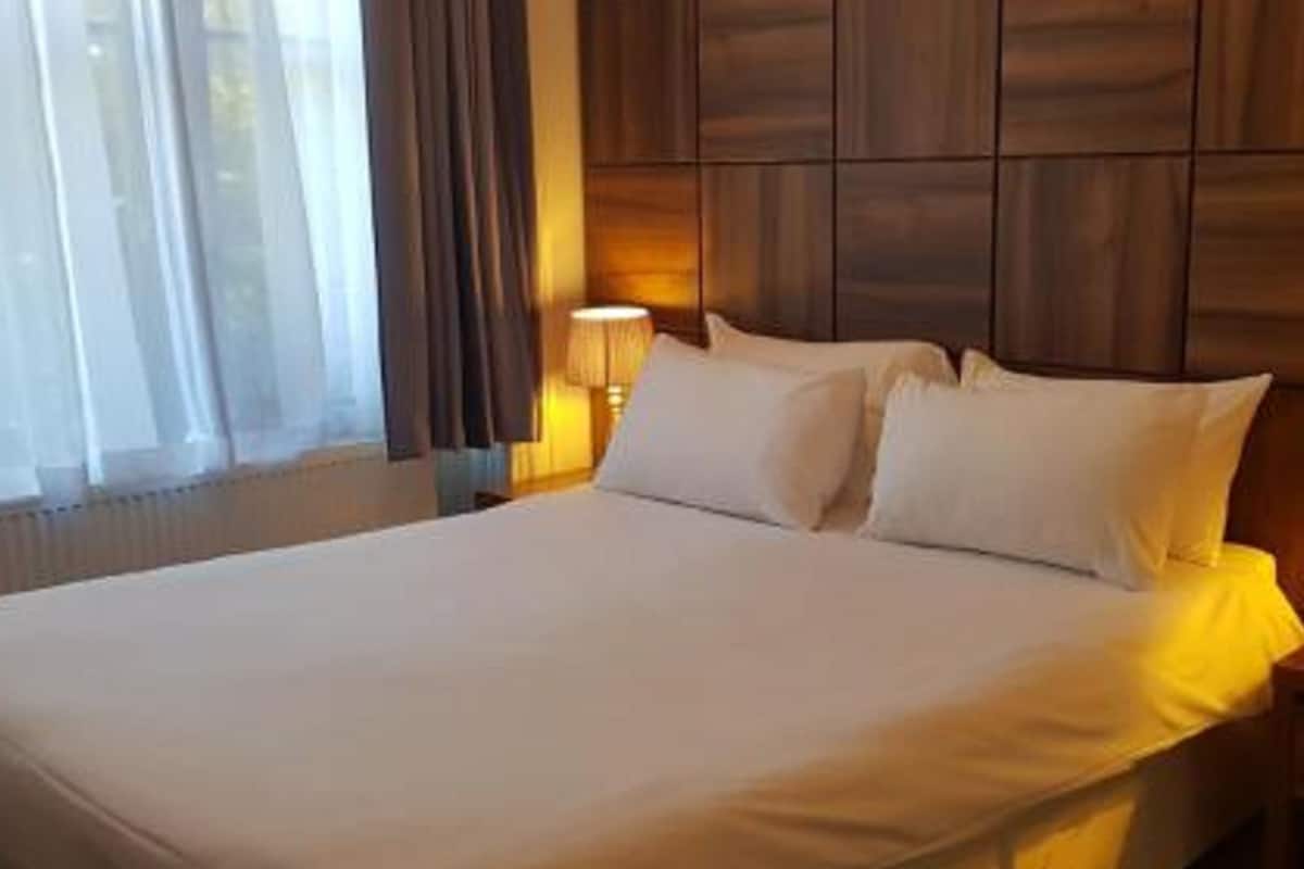 Premium bedding, pillowtop beds, desk, blackout drapes