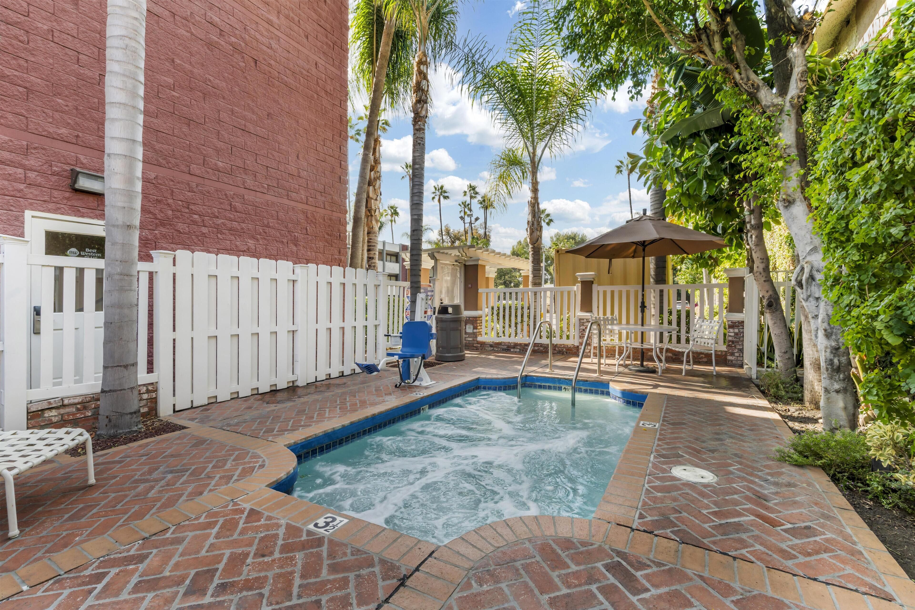 Outdoor pool, open 9:00 AM to 10:00 PM, pool umbrellas, pool loungers