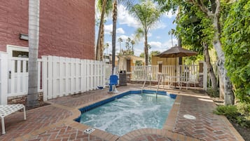 Outdoor pool, open 9:00 AM to 10:00 PM, pool umbrellas, pool loungers