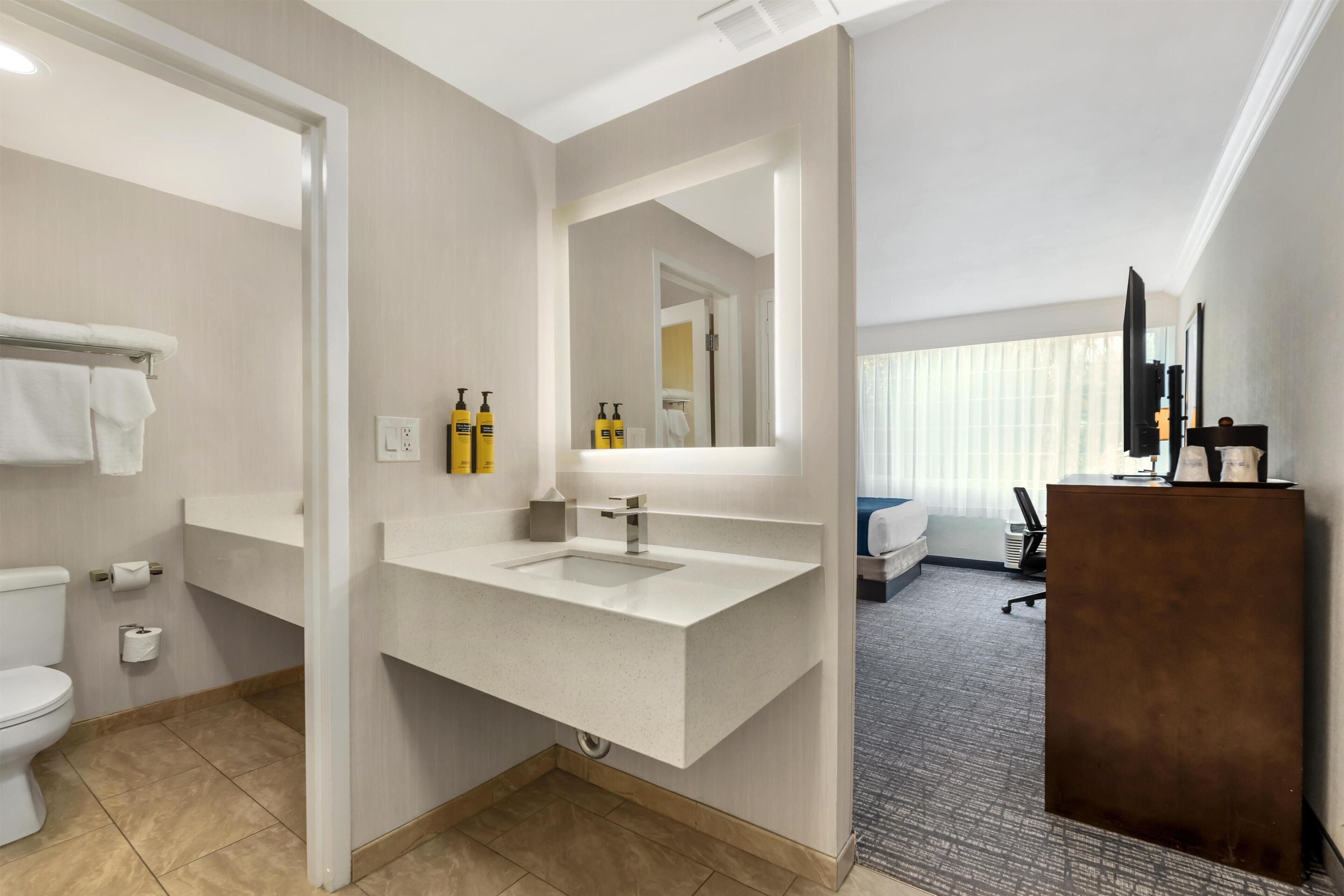 Standard Room, 2 Queen Beds, Non Smoking (Pet Friendly) | Bathroom | Combined shower/tub, free toiletries, hair dryer, towels
