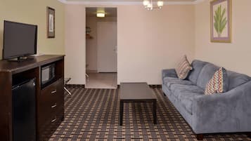 Premium bedding, desk, laptop workspace, blackout drapes
