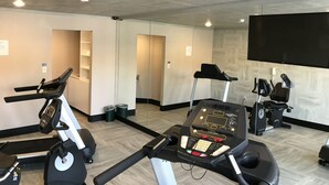 A gym with treadmills, an elliptical, and a stationary bike. - Quality Inn Cedar City - University Area (Cedar City)