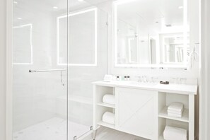 Designer toiletries, hair dryer, bathrobes, slippers