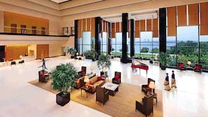 A spacious lobby with a grand piano, seating areas, and a reception desk. - The Oberoi Mumbai (Mumbai)