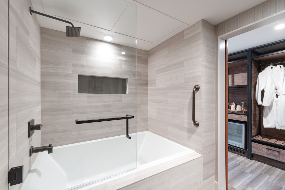 Shower, designer toiletries, hair dryer, bathrobes