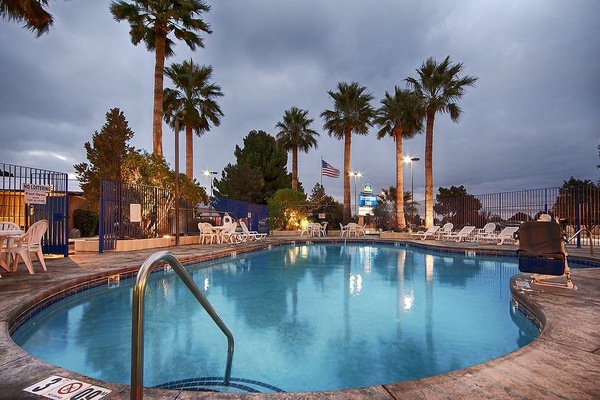 Seasonal outdoor pool, open 8:00 AM to 8:00 PM, pool umbrellas