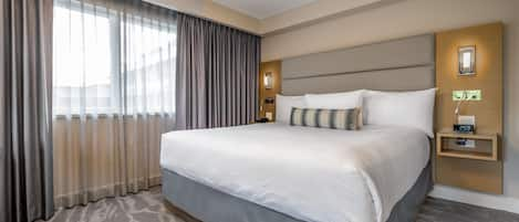 Suite, 1 King Bed with Sofa bed | 1 bedroom, pillowtop beds, in-room safe, blackout drapes