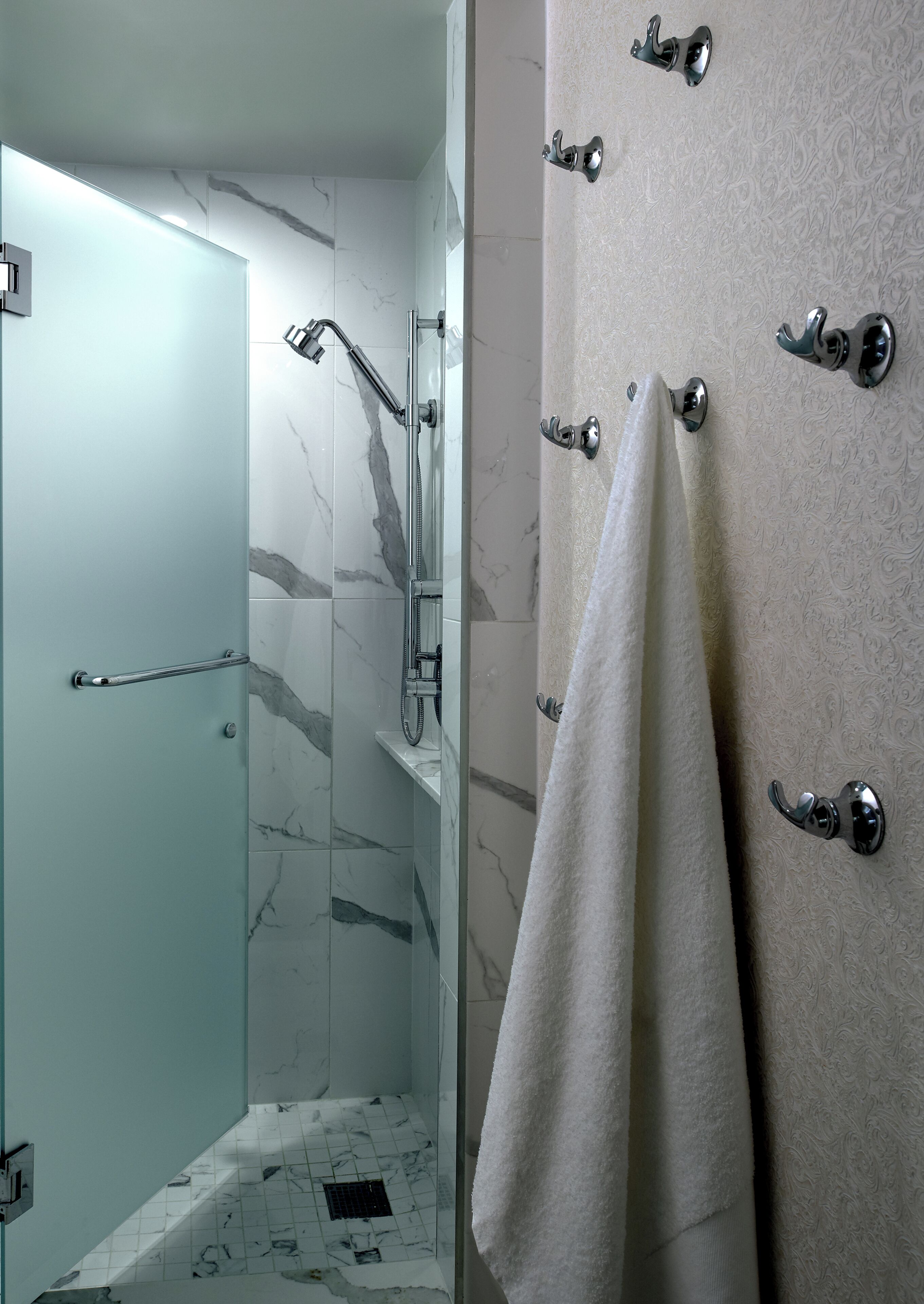 Shower, designer toiletries, hair dryer, bathrobes