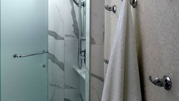 Shower, designer toiletries, hair dryer, bathrobes