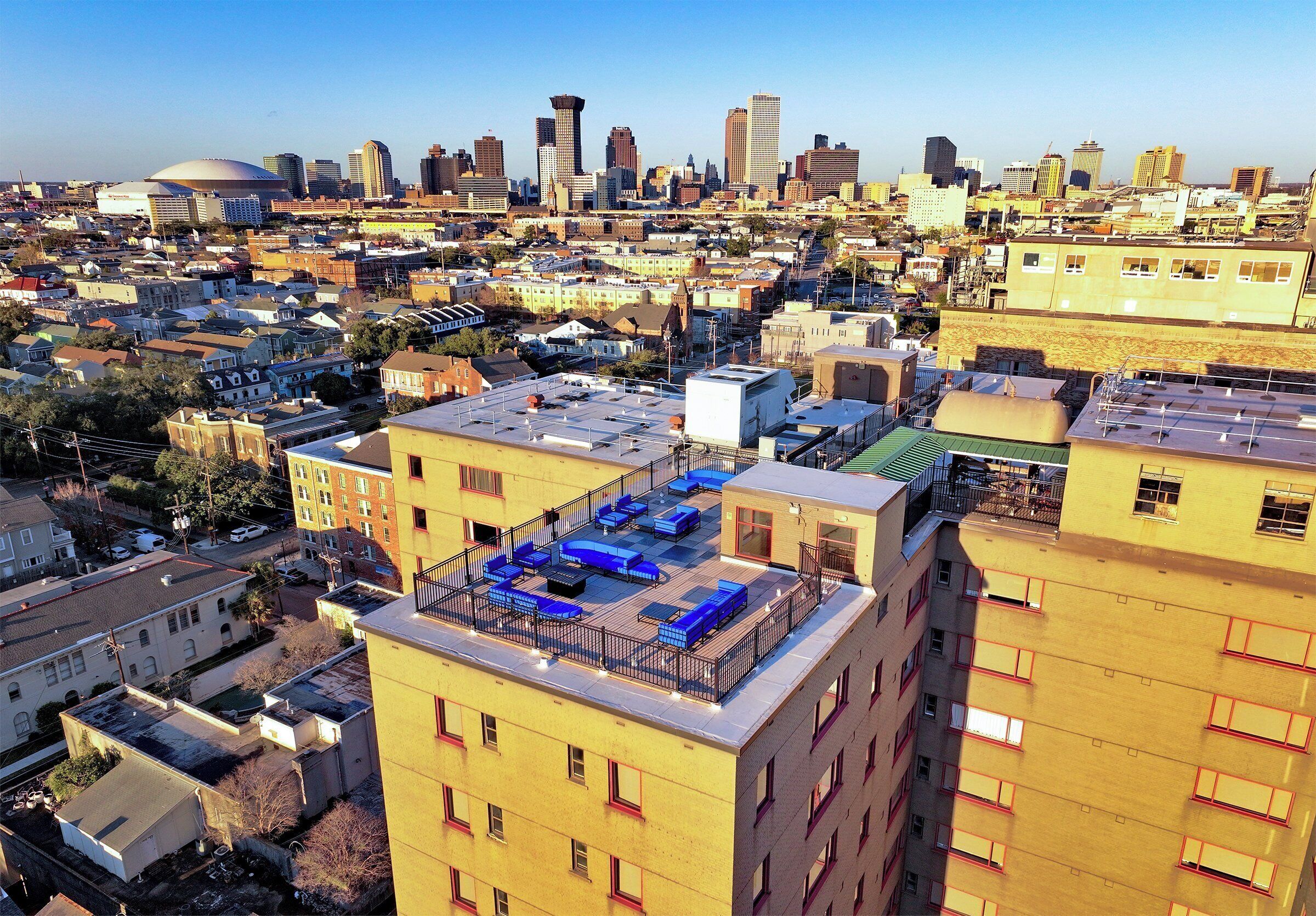 A high-rise building with multiple floors, some with balconies.