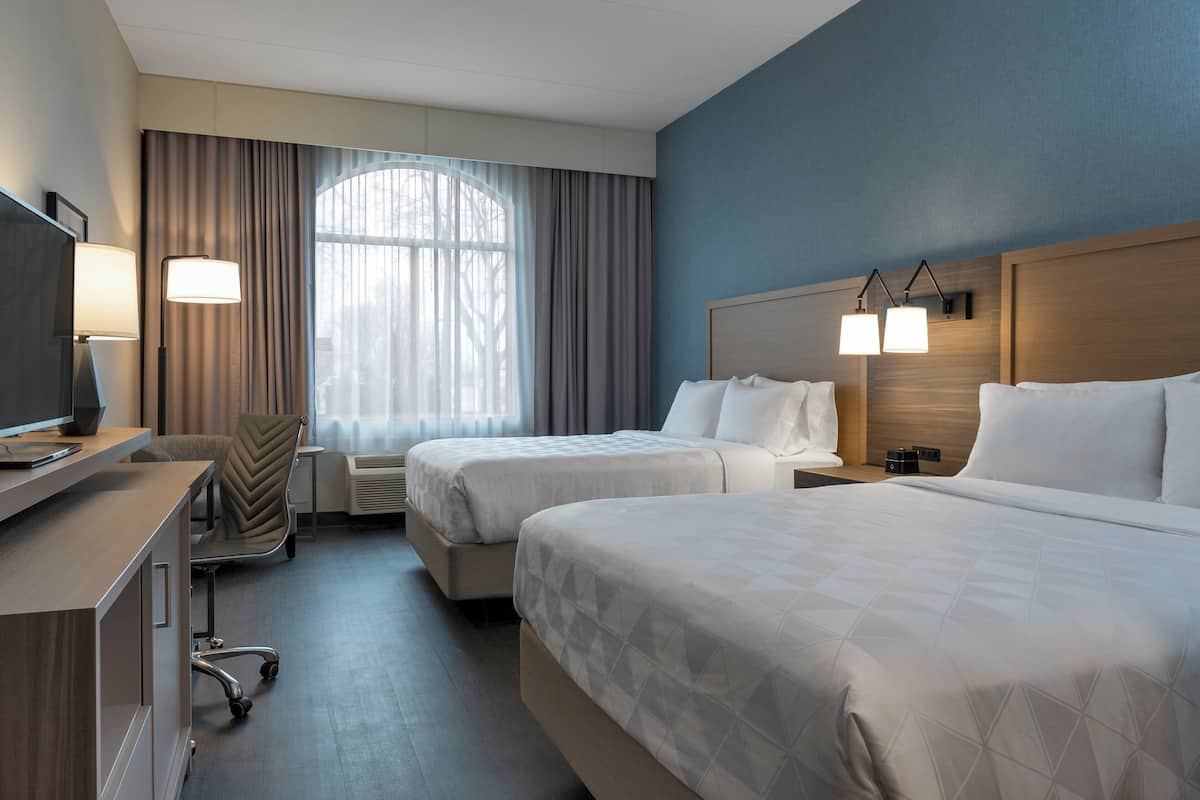 Standard Room, 2 Queen Beds, Ground Floor (Pet Friendly) | 1 bedroom, hypo-allergenic bedding, desk, blackout drapes