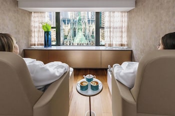 Hotel amenities such as safe, desk and work area at Lotte New York Palace