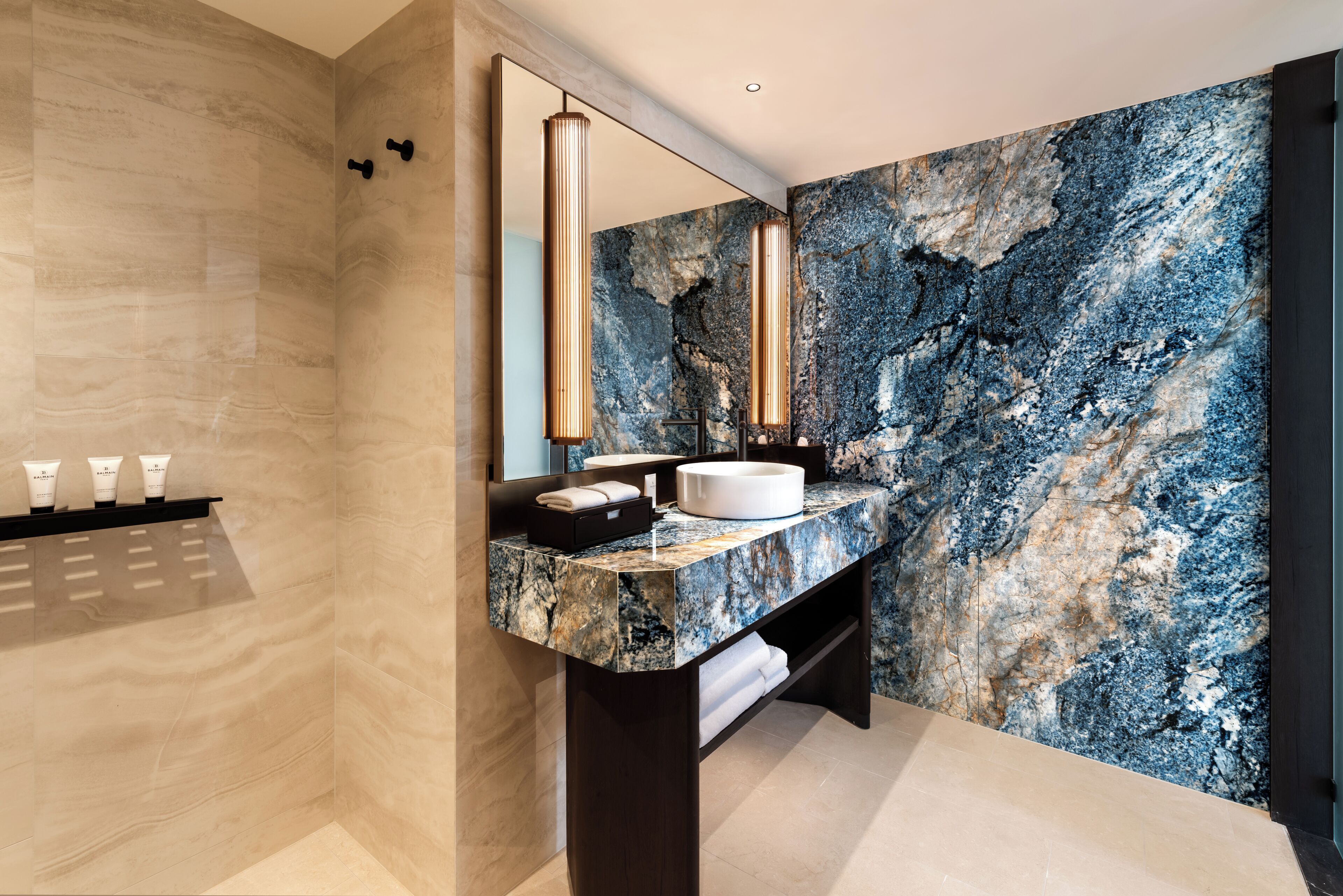 premier river view suite | bathroom | shower, free toiletries, hair dryer, towels