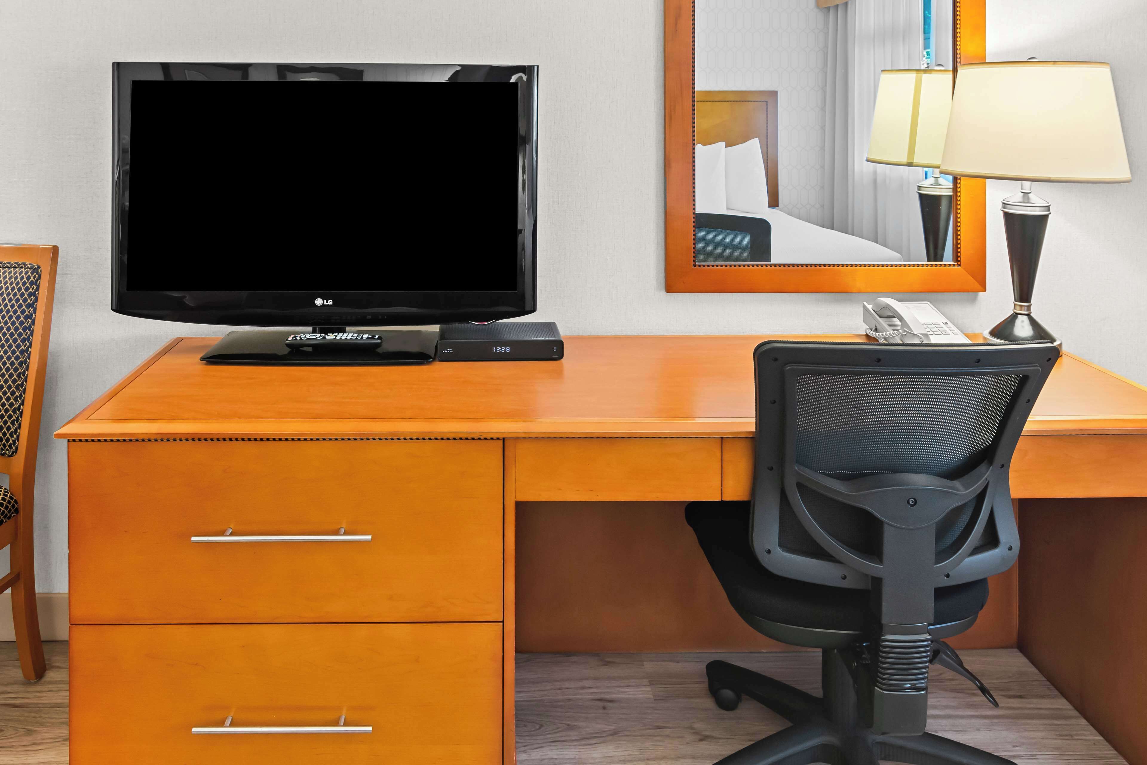 premium bedding, desk, laptop workspace, blackout curtains