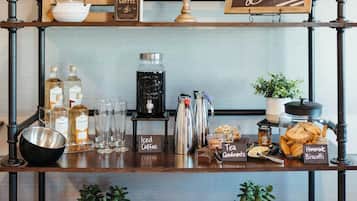 A coffee station with a globe, books, and a sign that reads "Coffee Break".