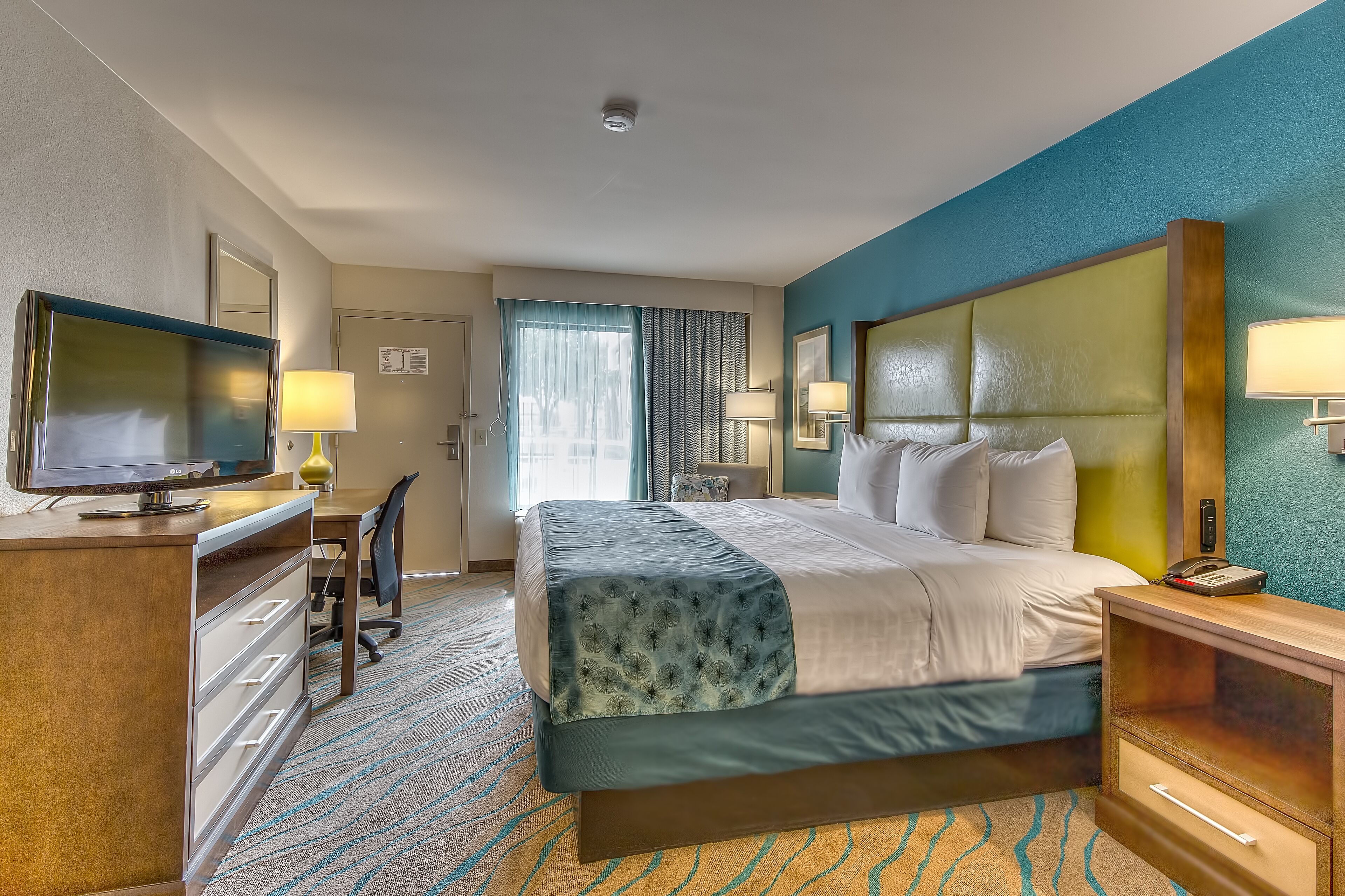 premium bedding, desk, laptop workspace, blackout curtains