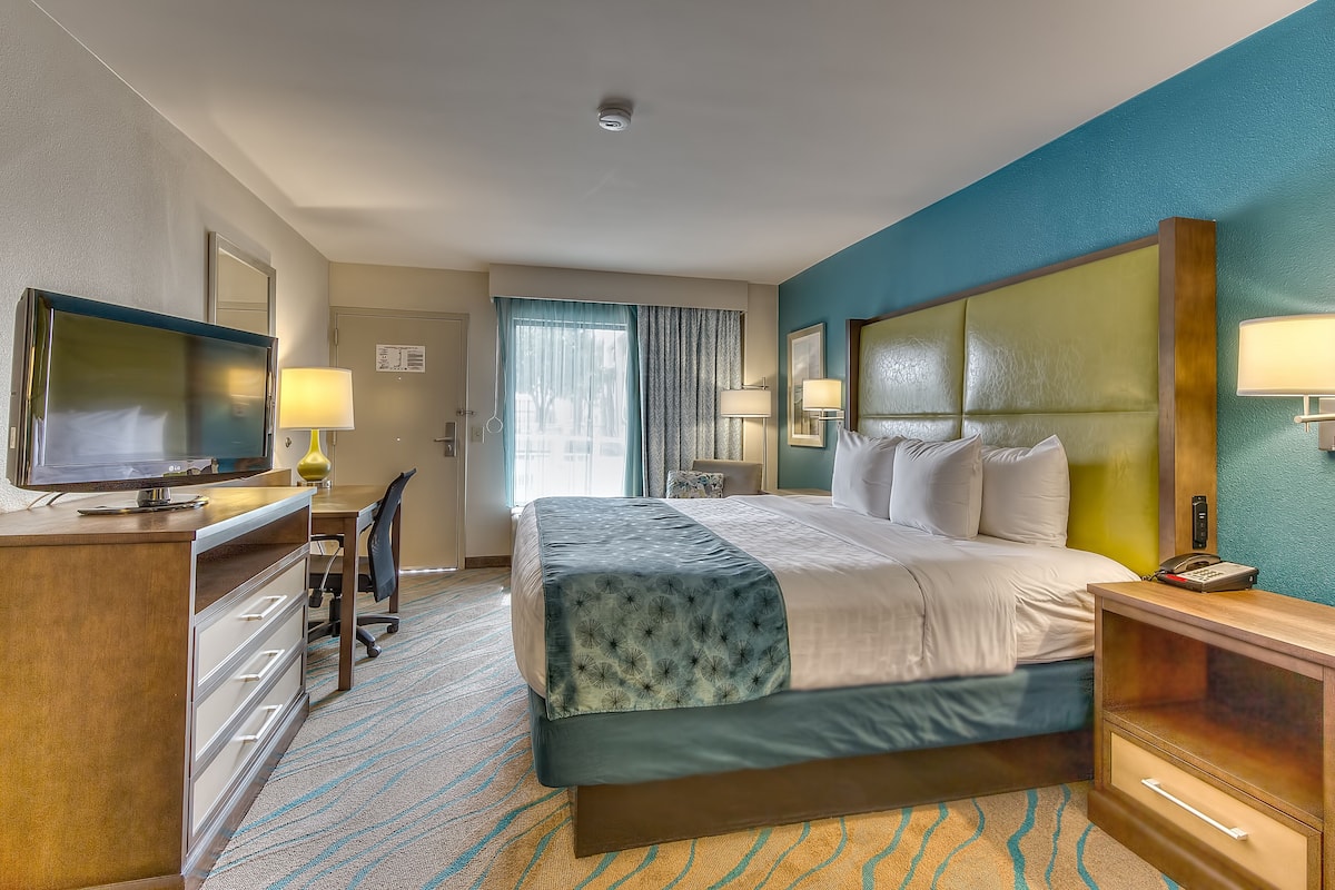 premium bedding, desk, laptop workspace, blackout curtains