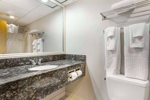 Standard Room, 2 Queen Beds, Non Smoking, Refrigerator & Microwave | Bathroom | Combined shower/bathtub, hair dryer, towels