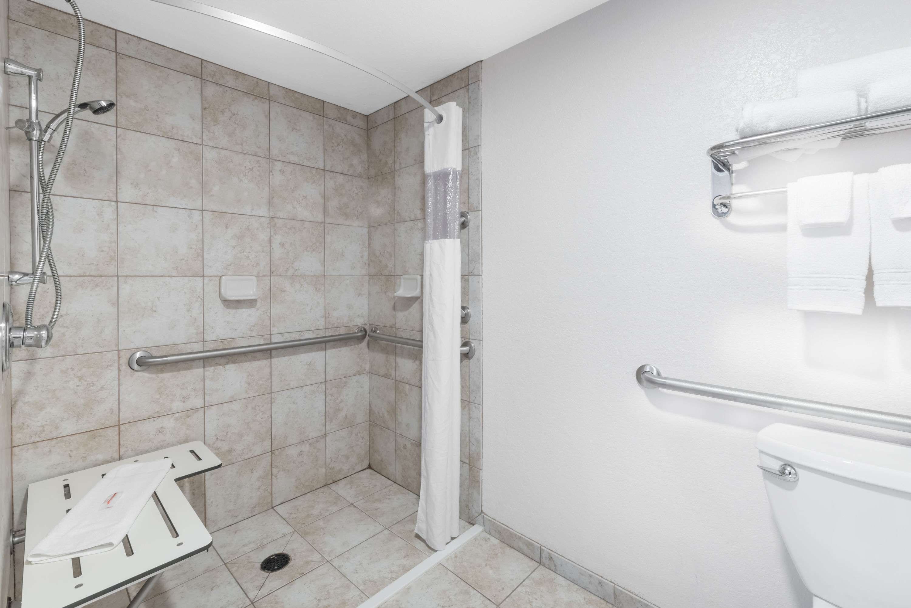 combined shower/bathtub, free toiletries, hair dryer, towels